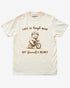 'Life Is Tough Man Get Yourself A Helmet' shirt in ivory with a retro graphic of a little bear riding a bycicle.