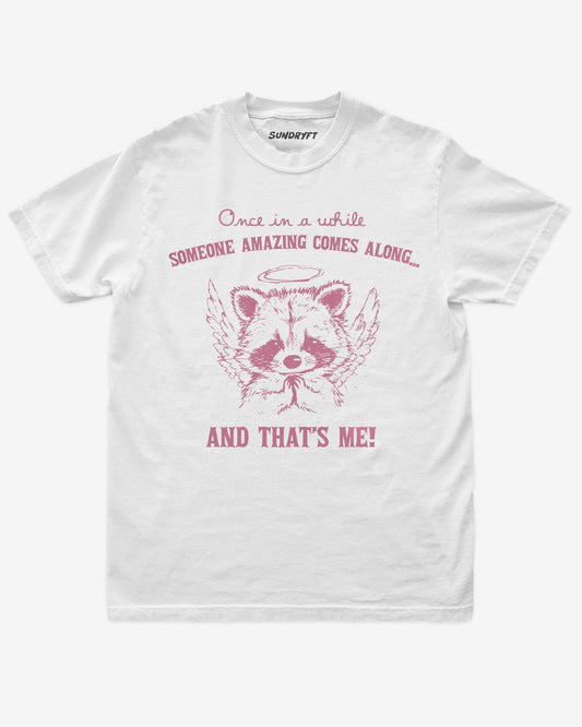 White “Every Once In A While Someone Amazing Comes Along And That’s Me” funny confidence shirt flat lay.