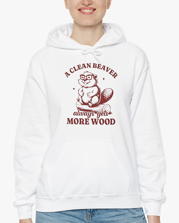 Woman wearing white 'A Clean Beaver Always Gets More Wood' hoodie with funny retro beaver sitting on a wood stump graphic