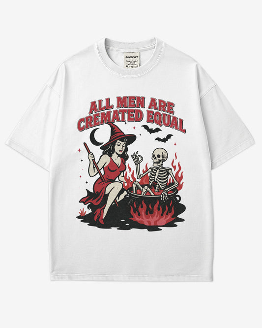 Flat lay white “All Men Are Cremated Equal” shirt with a retro Halloween graphic of a witch stirring a skeleton in a cauldron.