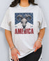 Model wearing ash color shirt with 'America Est 1776' graphic design