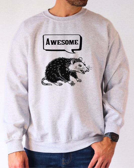Model wearing ash color sweatshirt with 'Awesome Opossum' graphic design