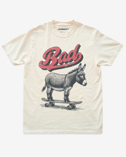 Ivory “Badass Donkey On Skateboard” funny retro skate pun shirt flat lay.