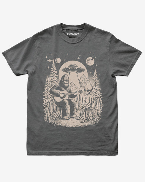 Bigfoot Playing Guitar With Alien And UFO Shirt on pepper gray tee with funny forest UFO design