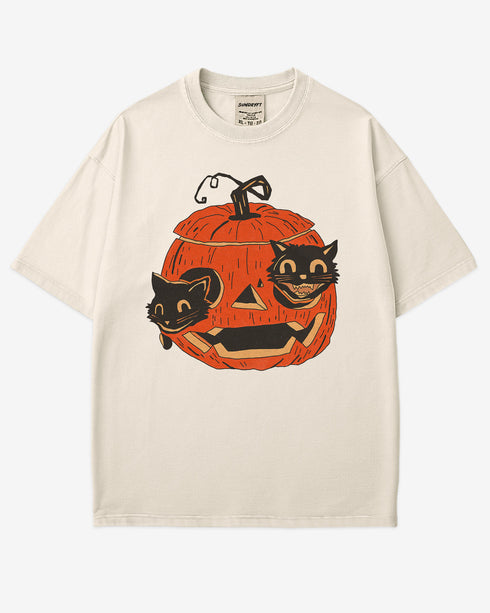 ivory-colored Black Cats in Pumpkin Shirt โ retro graphic tee with two black cats inside a carved Halloween pumpkin