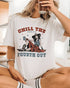 Model wearing white color shirt with 'Chill The Fourth Out' graphic design