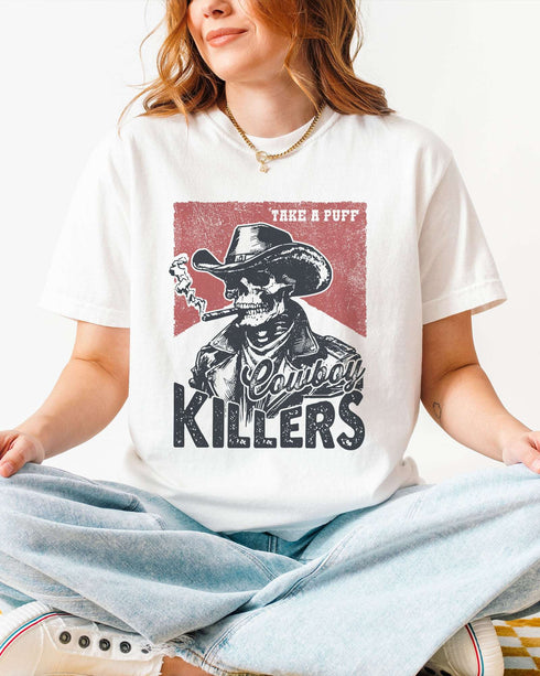Model wearing white color shirt with 'Cowboy Killers' funny smoking skeleton graphic design