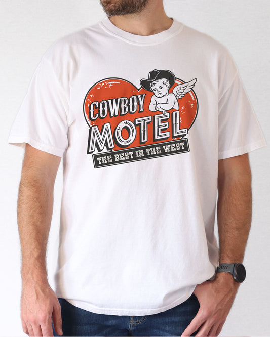 Model wearing white color shirt with 'Cowboy Motel - The Best In The West' Valentine's Day graphic design