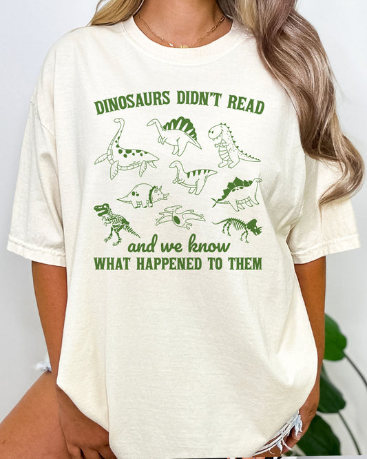 Funny reading motivation shirt in natural beige color with the quote "Dinosaurs didn't read and we know what happened to them"