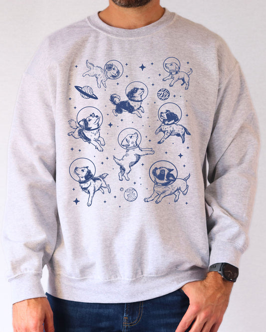 Model wearing ash color sweatshirt with 'Dogs In Space' graphic design