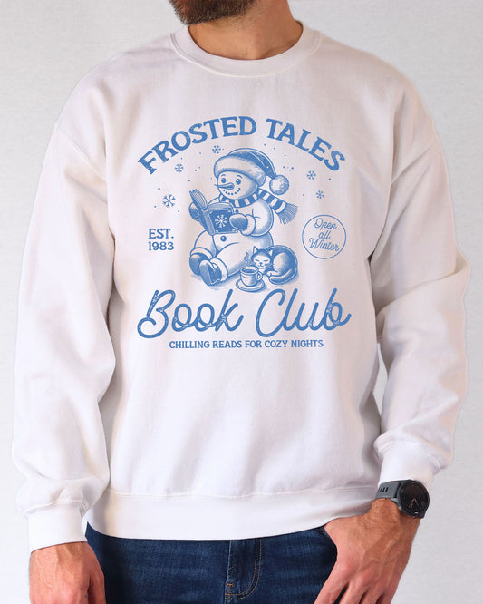 Model wearing white color sweatshirt with 'Frosted Tales Book Club' graphic design
