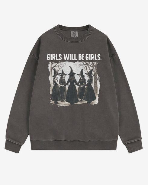 Flat lay pepper 'Girls Will Be Girls' sweatshirt with retro graphic of witches holding hands in a Halloween ritual.