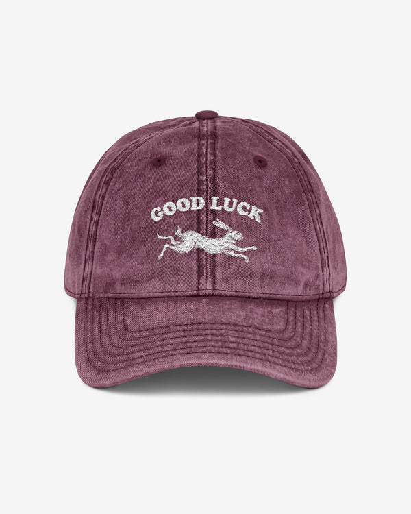 Good Luck embroidered vintage cap in maroon with retro graphic of running rabbit