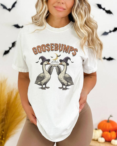 Model wearing white color shirt with 'Goosebumps' funny Halloween graphic design