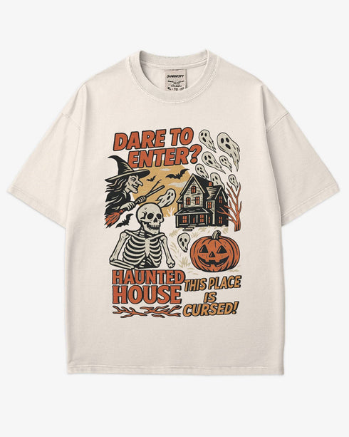 Flat lay ivory "Dare To Enter? - Haunted House" shirt with a retro Halloween graphic of a haunted house, witch, skeletons, and ghosts.