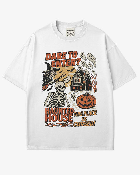 Flat lay white "Dare To Enter? - Haunted House" shirt with a retro Halloween graphic of a haunted house, witch, skeletons, and ghosts.