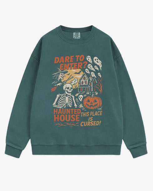 Flat lay blue spruce Halloween sweatshirt reading ‘Dare To Enter – Haunted House’ with retro graphic of haunted house, skeletons, and a witch.