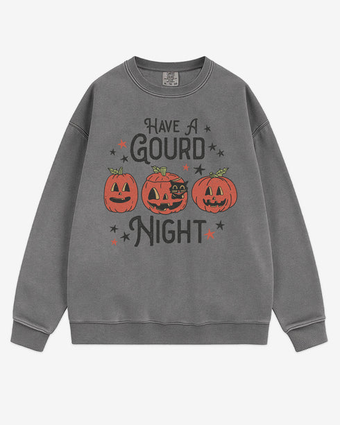 Flat lay gray ‘Have A Gourd Night’ sweatshirt with retro pumpkins and black cat graphic.