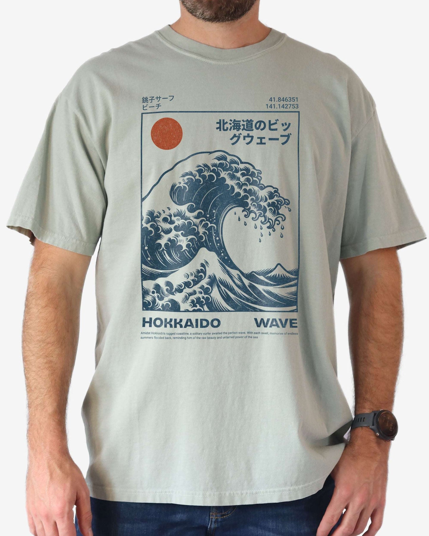 Man wearing a bay ‘Hokkaido Wave’ surf shirt with a retro Japanese great wave graphic in traditional ukiyo-e style.