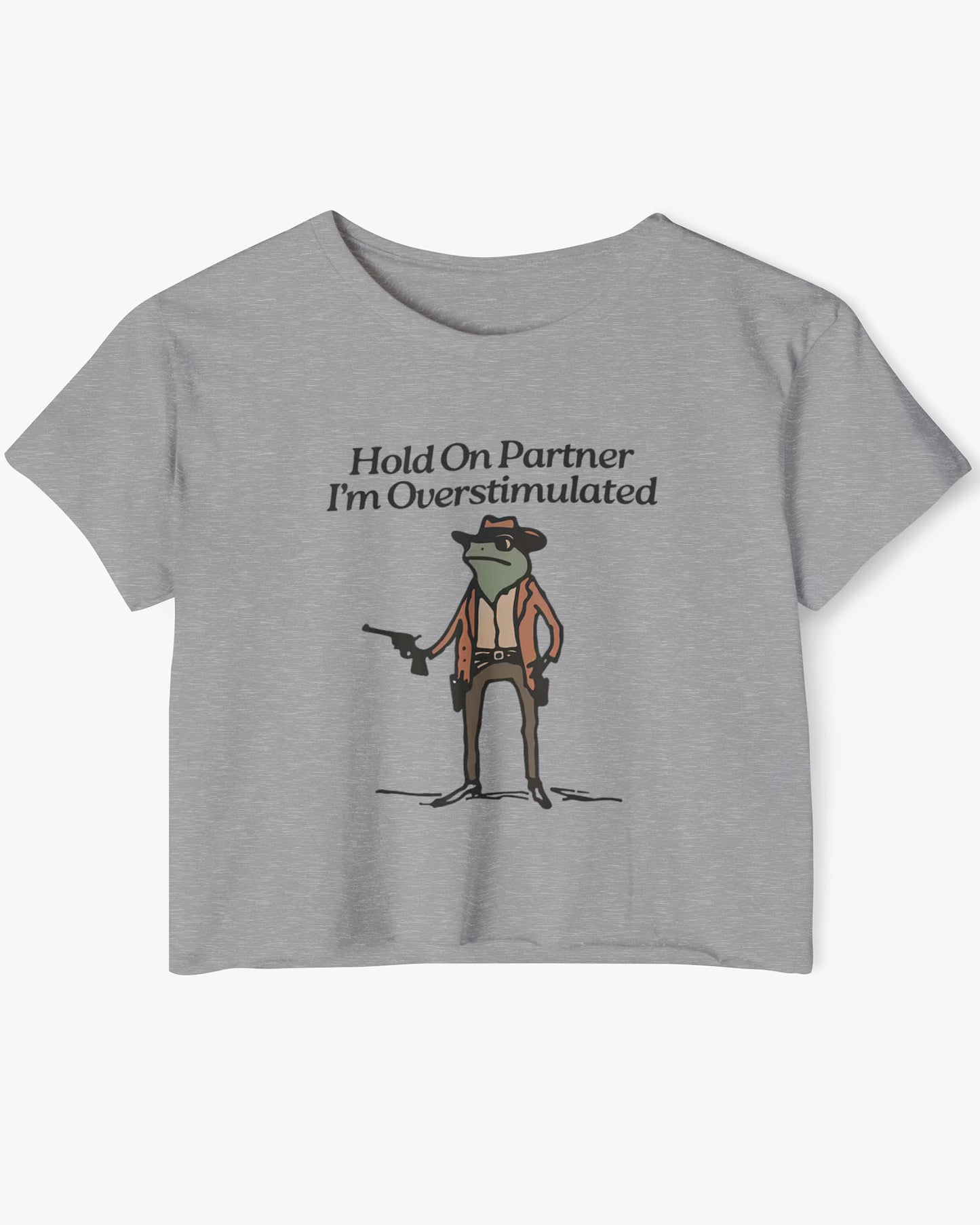 Flat lay heather gray 'Hold On Partner, I'm Overstimulated' crop top featuring a funny retro cowboy frog graphic.