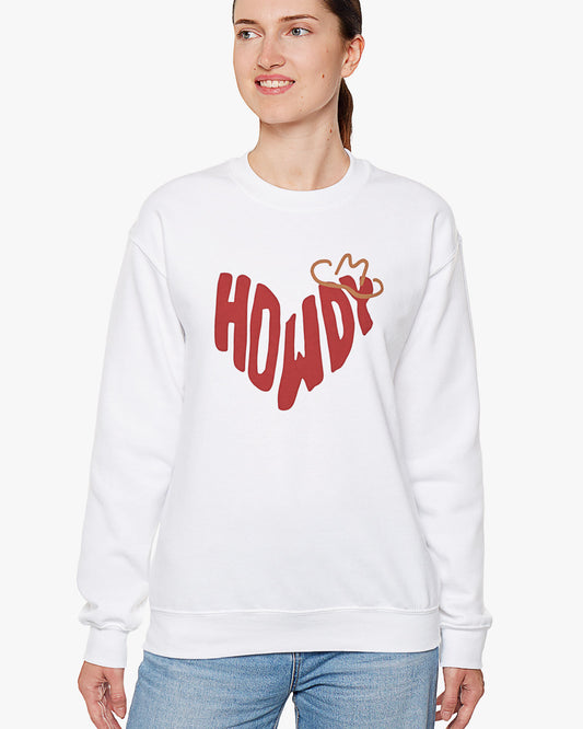 Woman wearing white sweatshirt with retro western 'Howdy' text shaped as a heart graphic.