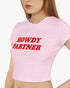 Woman wearing light pink 'Howdy Partner' baby tee