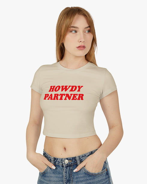 Woman wearing sand beige 'Howdy Partner' baby tee