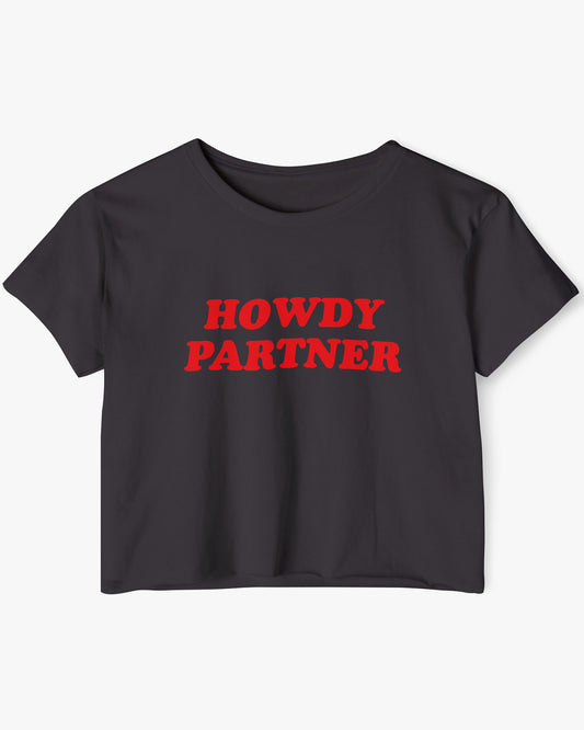 Flat lay black 'Howdy Partner' crop top.