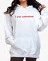 Woman wearing white-colored 'I Eat Asbestos' hoodie.