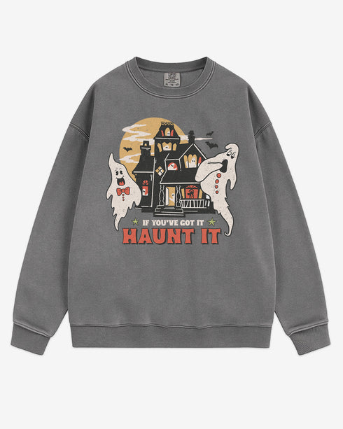 Flat lay gray sweatshirt with phrase ‘If You’ve Got It Haunt It’ and retro graphic of two ghosts and a haunted house.