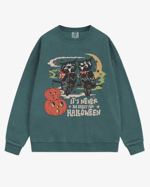 Flat lay blue spruce โItโs Never Too Early For Halloweenโ sweatshirt with retro graphic of two owls, pumpkins, and night sky.
