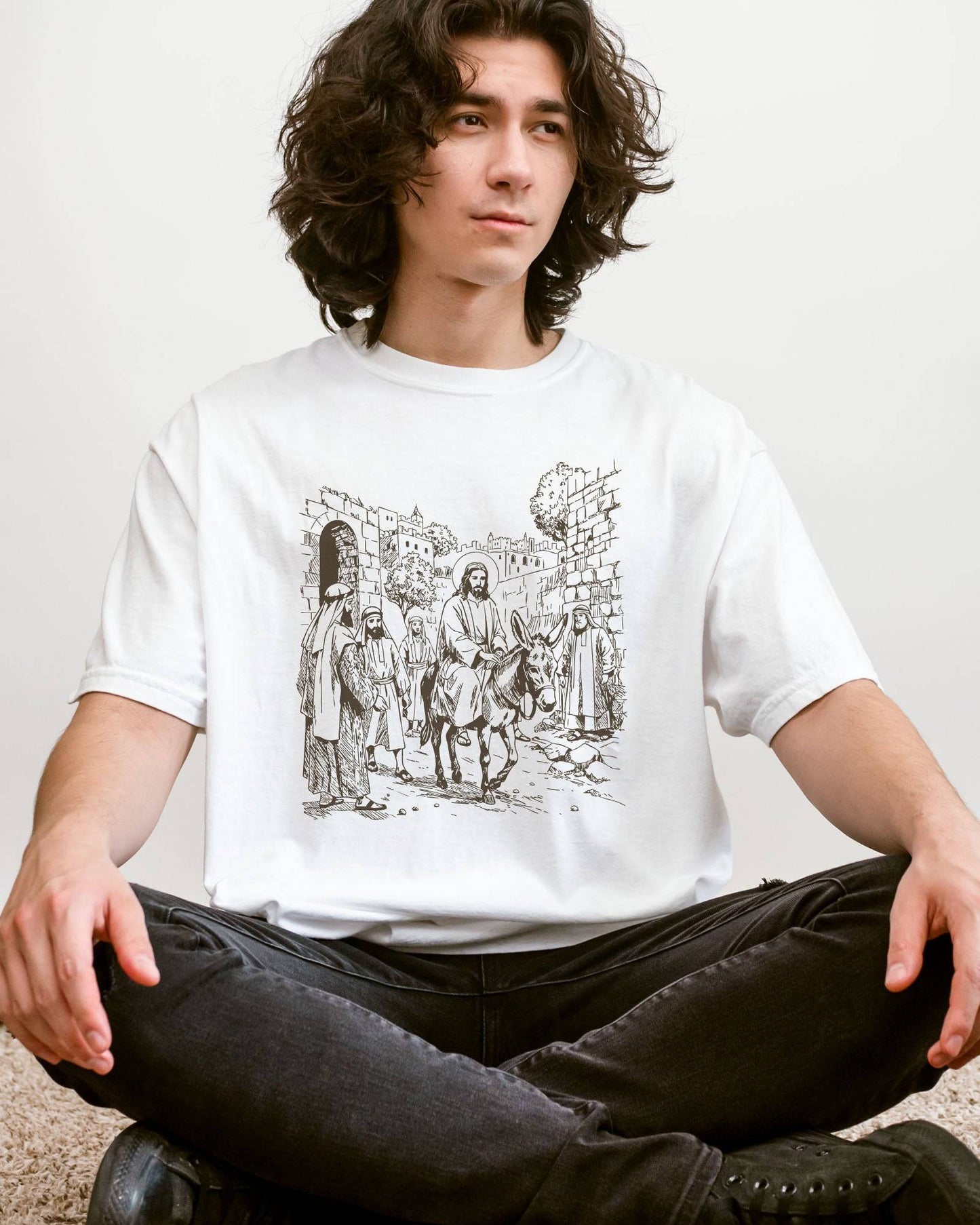 Man wearing white color shirt with Jesus Riding Donkey christian graphic design