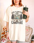 Woman wearing 'Life Is Better By The Campfire' shirt in ivory color and with retro camping nature graphic