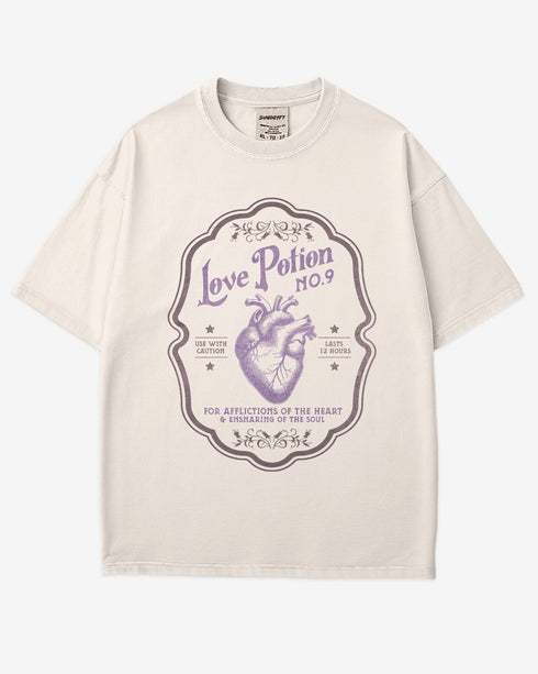 Love Potion Halloween Shirt in ivory color with retro potion label and heart graphic design