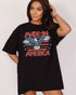 Woman wearing "Made In America 1776" shirt in black color with retro graphic of a hawk in USA red-white-and-blue colors.