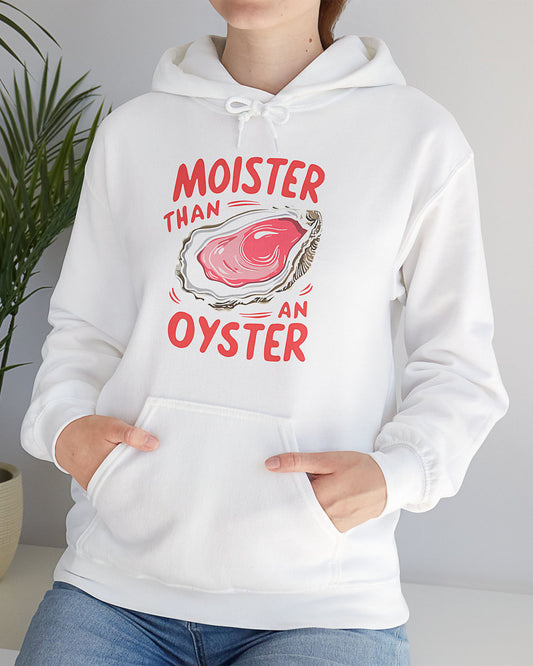 Woman wearing a white 'Moister Than An Oyster' hoodie featuring a funny oyster graphic.