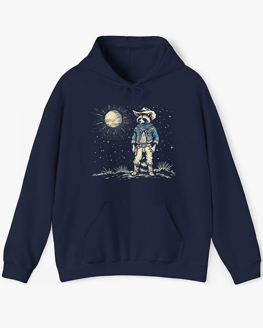 Flat lay navy blue hoodie featuring a retro Wild West graphic of a cowboy raccoon standing under a moonlit desert sky. The vintage-style design pops against the dark fabric.
