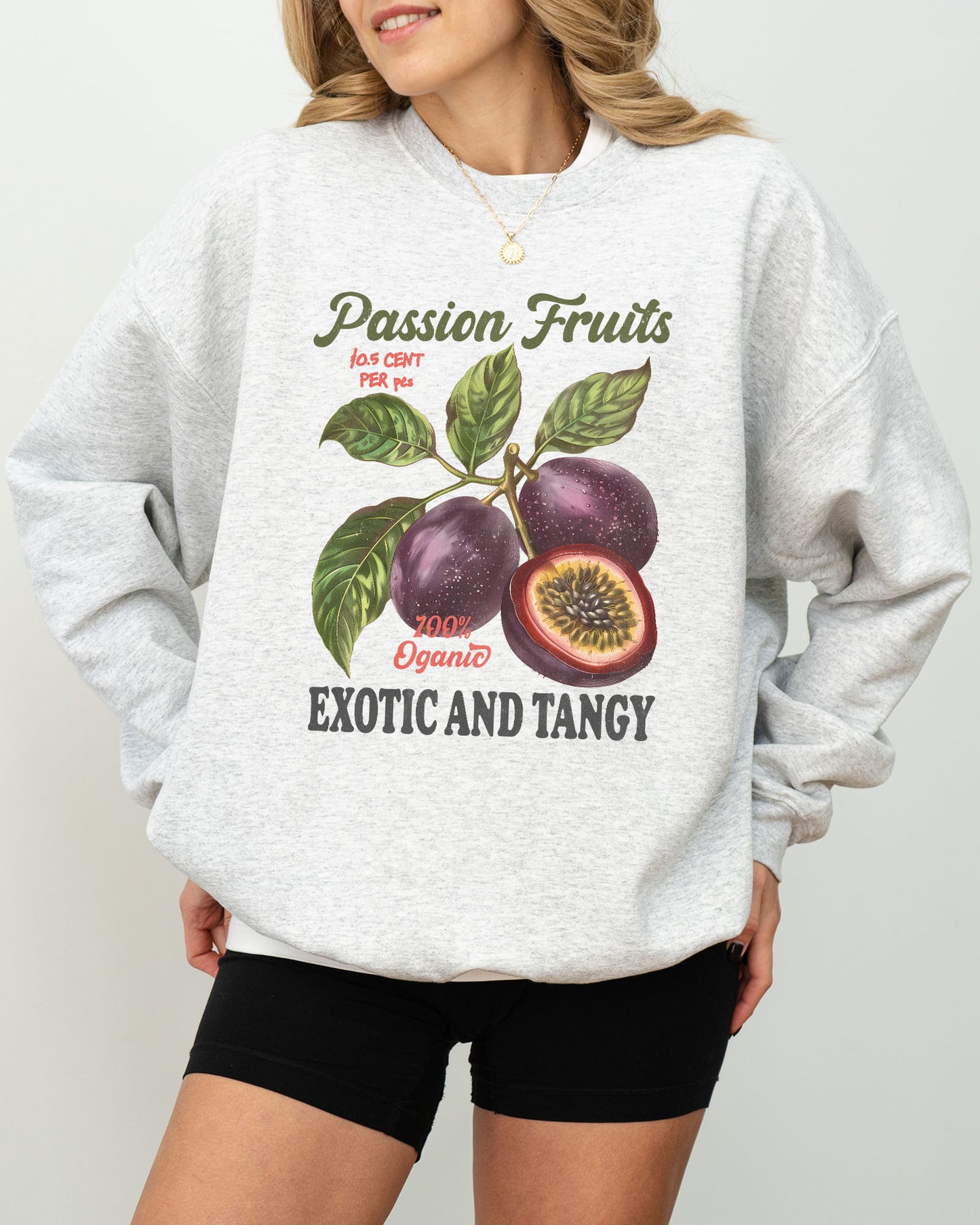Model wearing ash color sweatshirt with Passion Fruits retro commercial graphic design