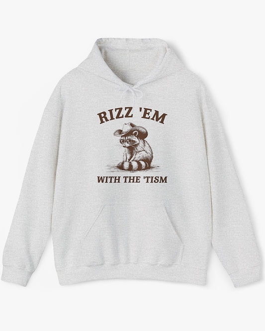Flat lay ash gray Rizz ‘Em With The Tism Hoodie, featuring a retro cowboy raccoon graphic with a funny slogan.