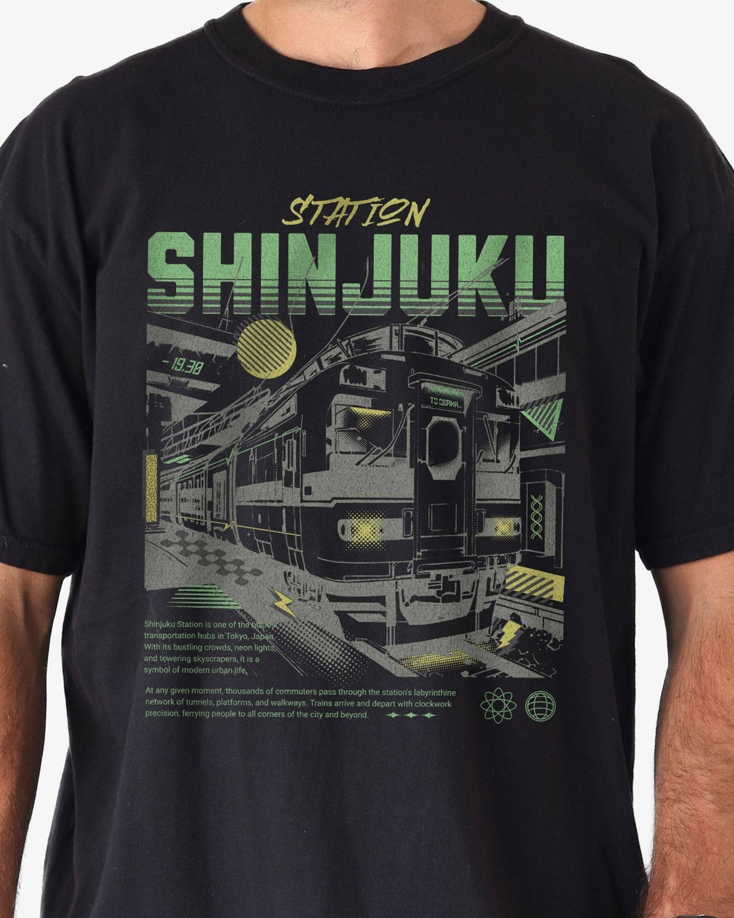 Close-up of man wearing black Shinjuku Train Station Tokyo retro graphic shirt.