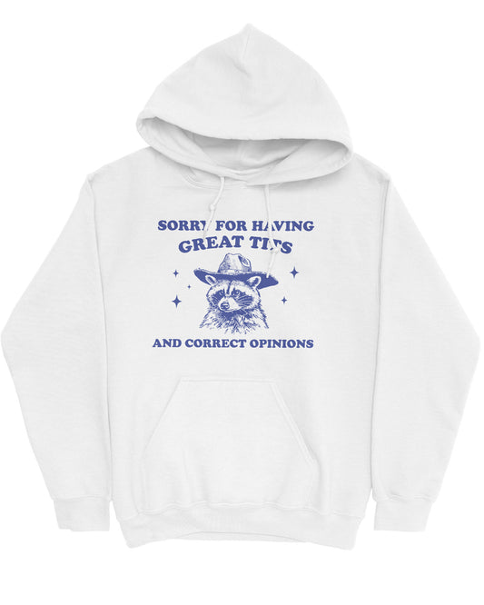 Flat lay of a white hoodie with a funny retro cowboy raccoon graphic and the phrase 'Sorry For Having Great Tits And Correct Opinions'.