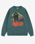 Flat lay blue spruce Halloween sweatshirt reading โSpooky Vibesโ with retro graphic of black cat standing on pumpkins.