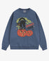 Flat lay denim Halloween sweatshirt reading โSpooky Vibesโ with retro graphic of black cat standing on pumpkins.