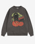 Flat lay pepper Halloween sweatshirt reading โSpooky Vibesโ with retro graphic of black cat standing on pumpkins.