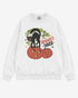 Flat lay white Halloween sweatshirt reading โSpooky Vibesโ with retro graphic of black cat standing on pumpkins.
