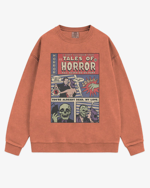 Flat lay terracotta 'Tales of Horror' sweatshirt with retro comic-style Halloween graphic of a spooky love story.