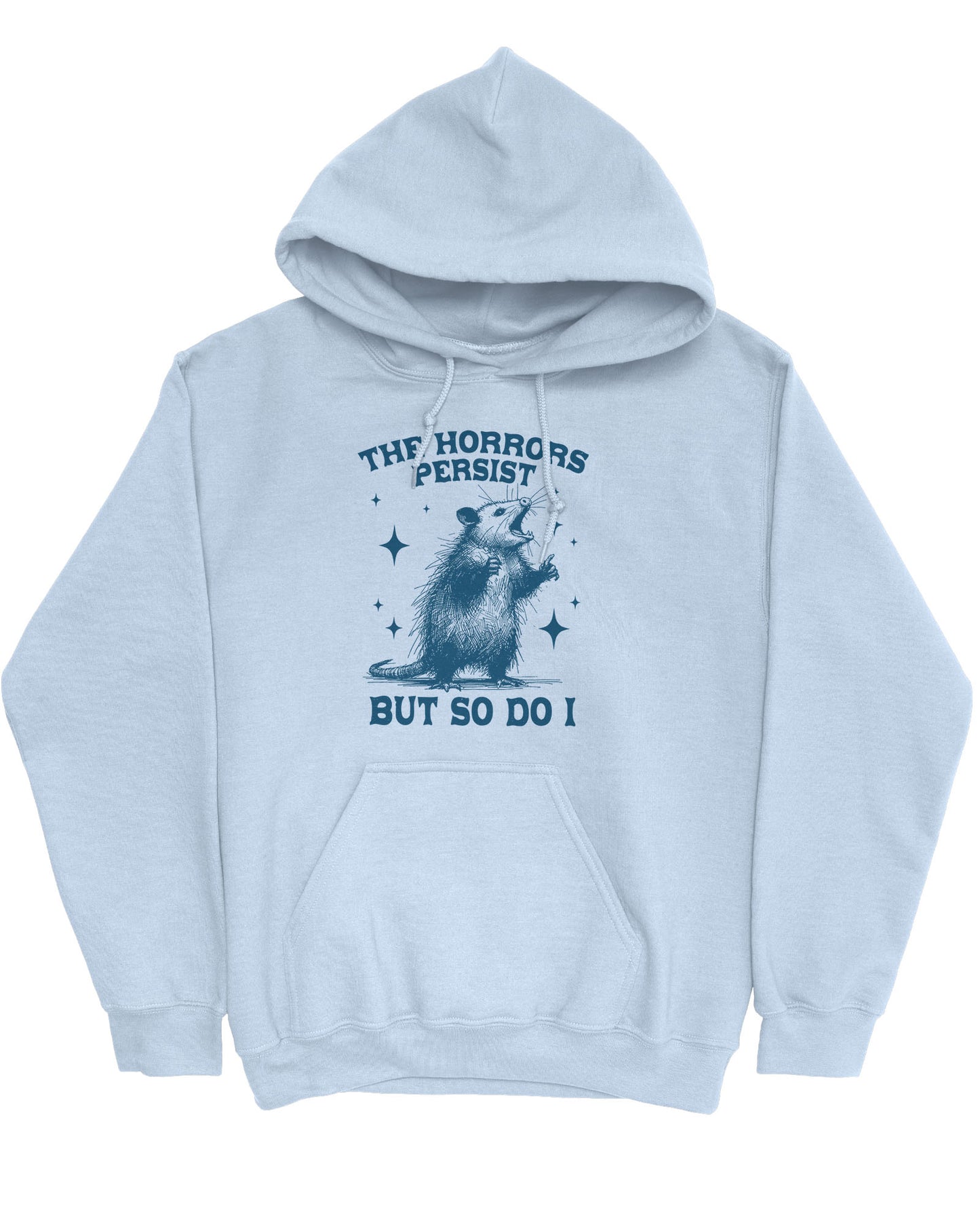 Flat lay of a light blue 'The Horrors Persist But So Do I' hoodie featuring a funny retro yelling opossum graphic.
