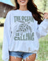 Model wearing white color sweatshirt with 'The Ocean Is Calling' graphic design