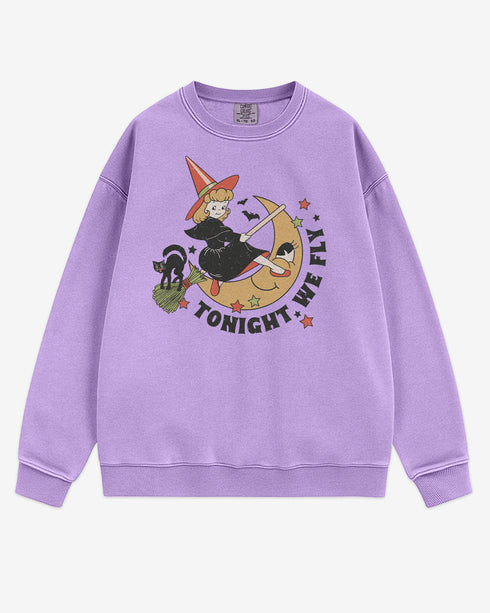 Flat lay orchid Tonight We Fly sweatshirt with retro witch on broomstick, moon, and black cat Halloween graphic clothing.