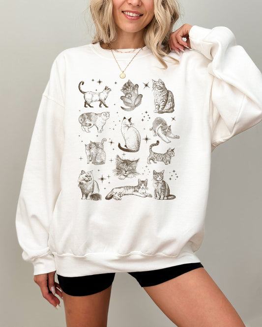 Model wearing white color sweatshirt with vintage cat collage graphic design